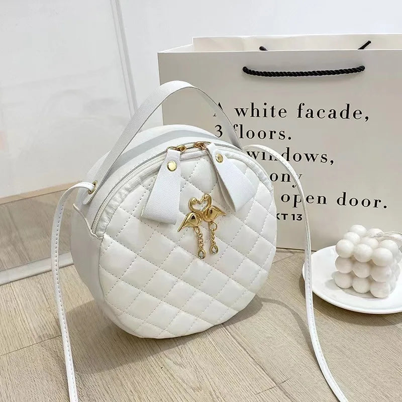 Chic Quilted Crossbody: Gold Swan Charm Edition